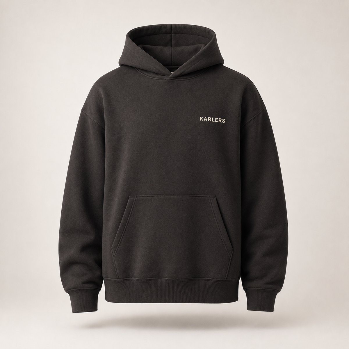Oversized KARLERS Essential Hoodie in ink, front view with bone embroidered chest wordmark