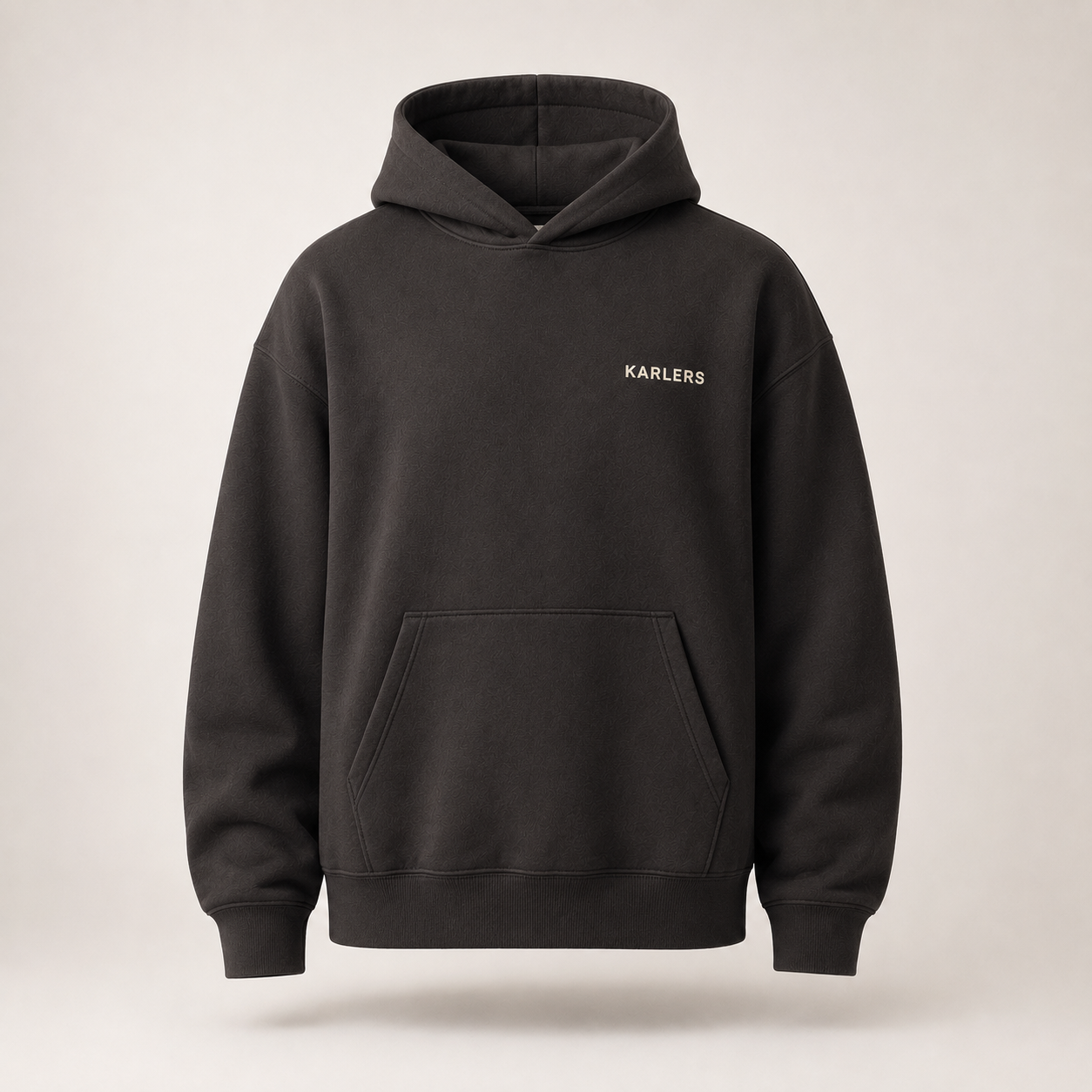 Oversized KARLERS Essential Hoodie in ink, front view with bone embroidered chest wordmark