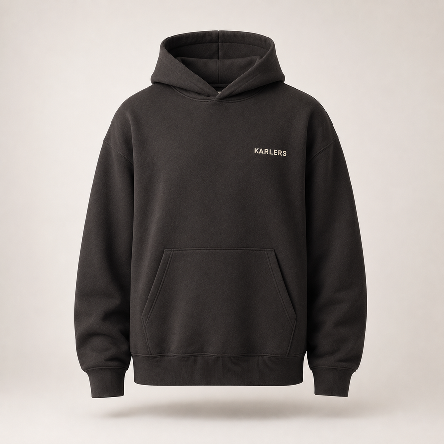 Oversized KARLERS Essential Hoodie in ink, front view with bone embroidered chest wordmark