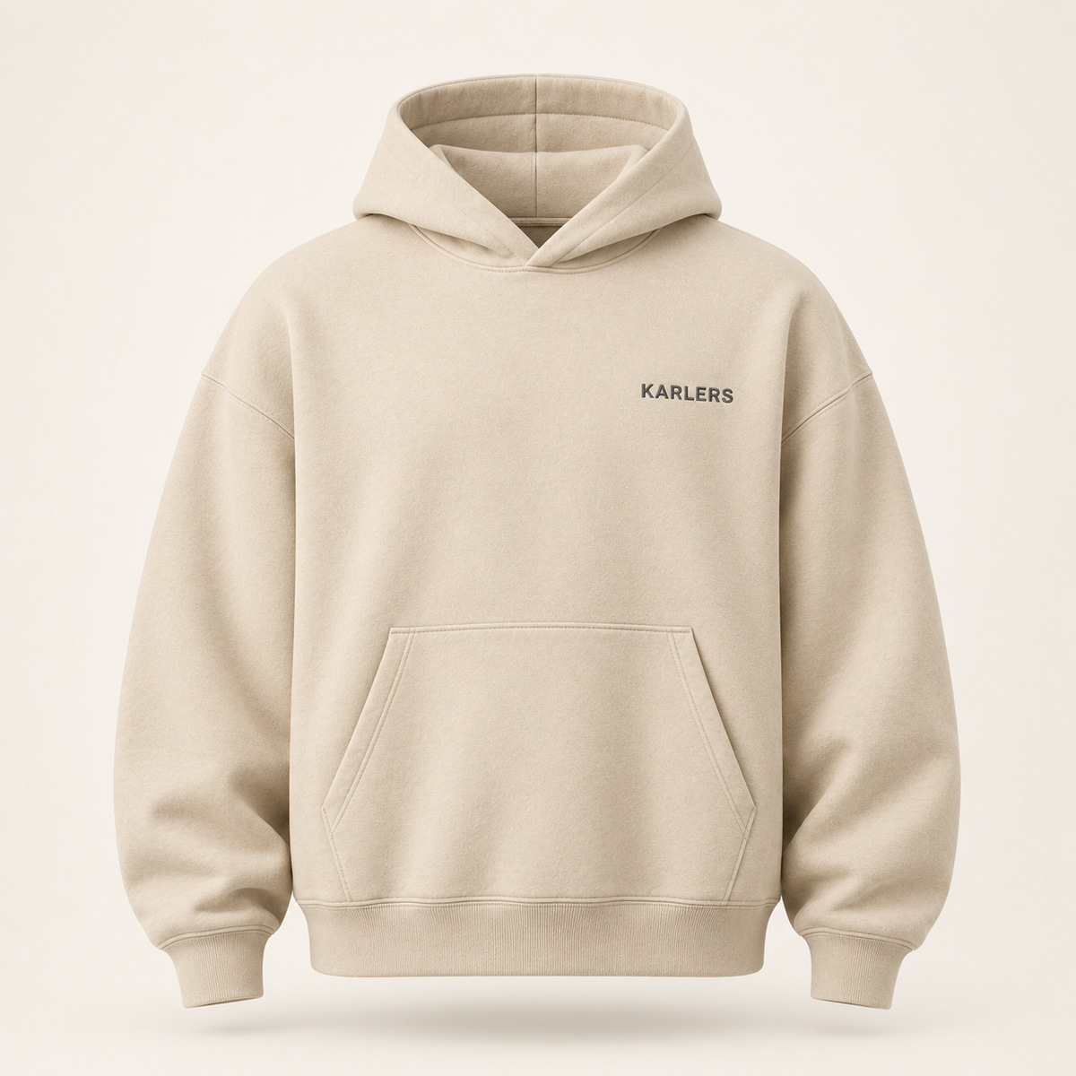 Oversized KARLERS Essential Hoodie in oat, front view with embroidered chest wordmark