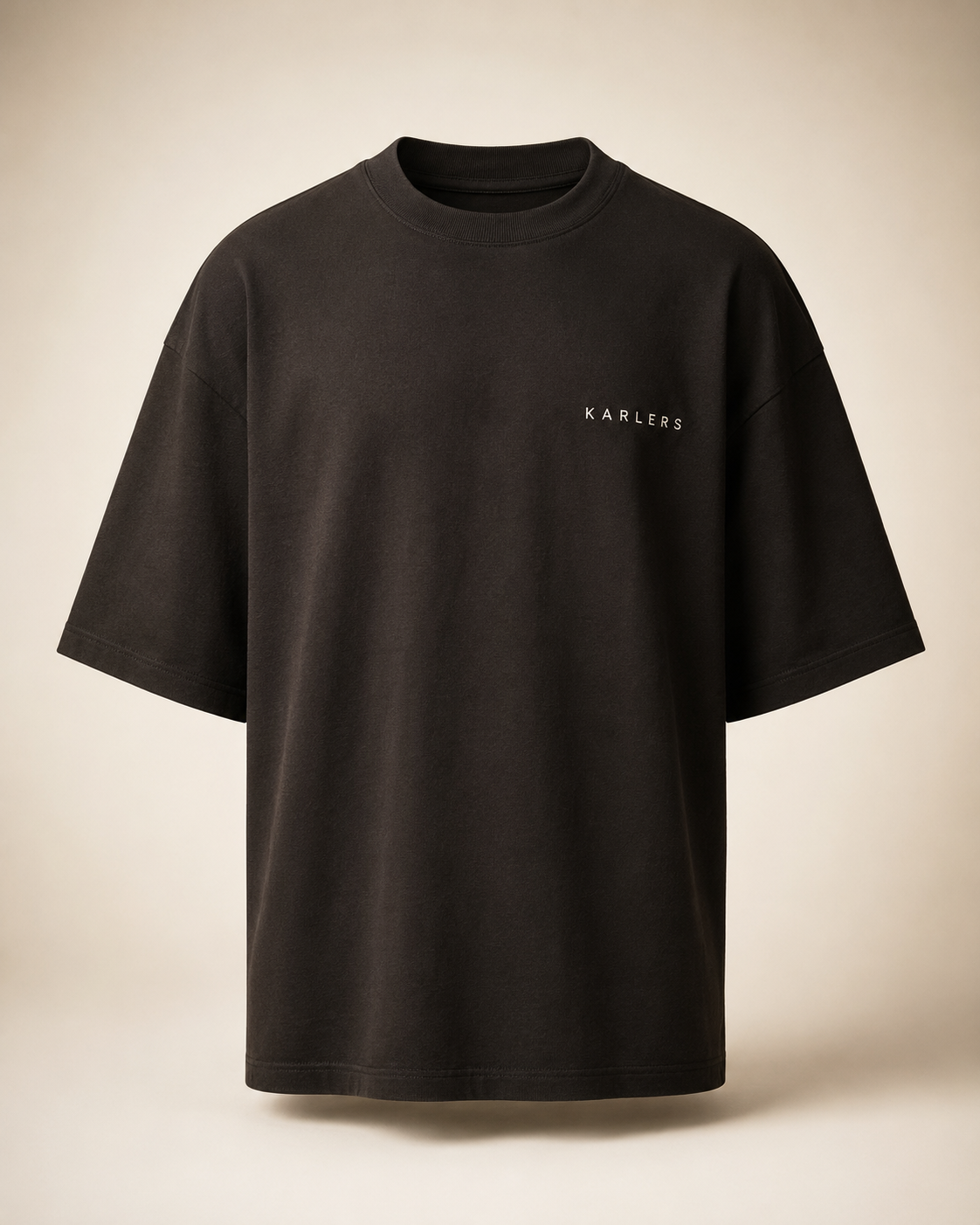 Oversized KARLERS Essential Tee in ink, front view with bone embroidered wordmark