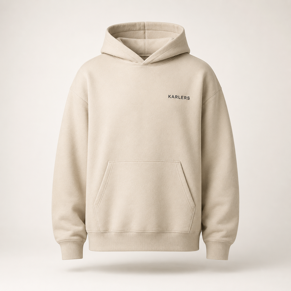KARLERS Essential Hoodie in oat, front view showing the kangaroo pocket and ribbed hem