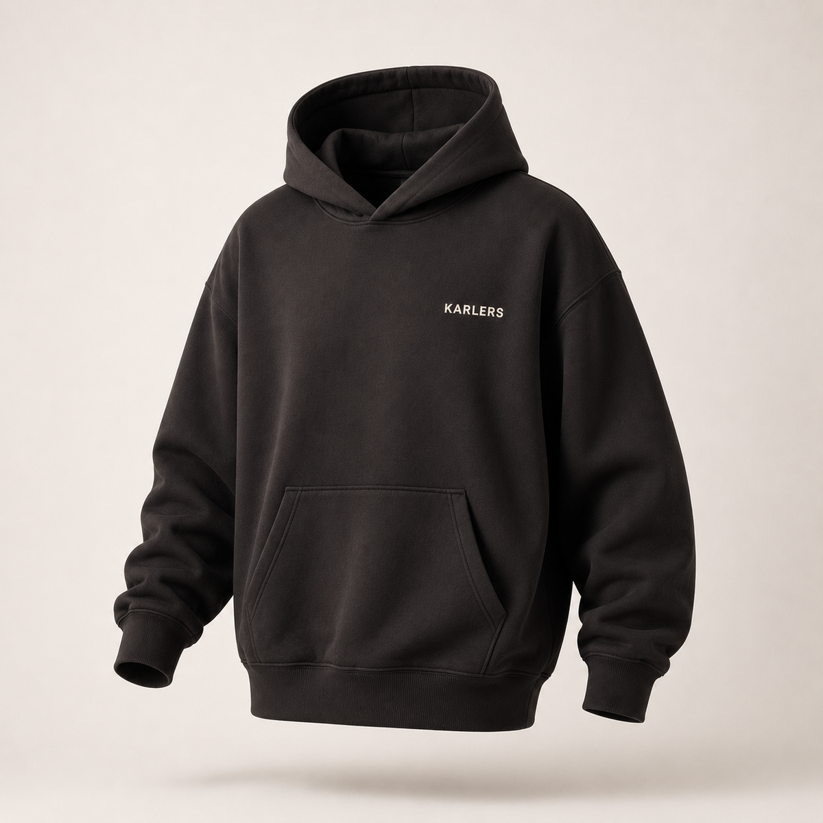 KARLERS Essential Hoodie in ink, three-quarter view showing the dropped shoulder and hood