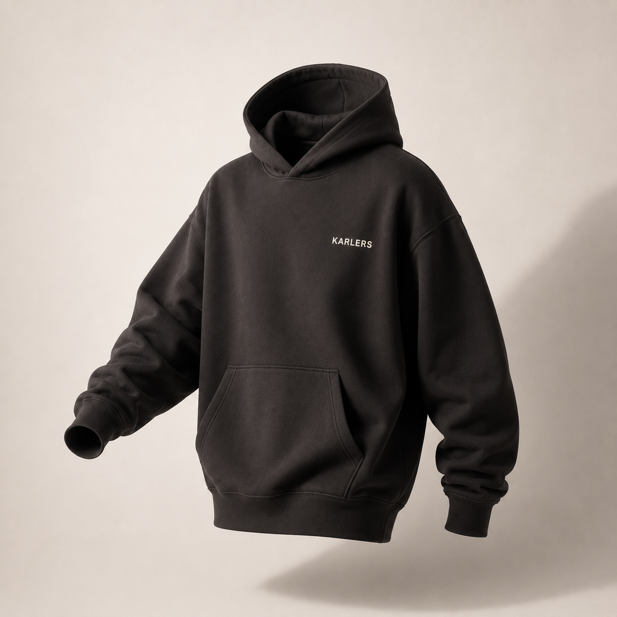 KARLERS Essential Hoodie in ink, angled view under directional studio light