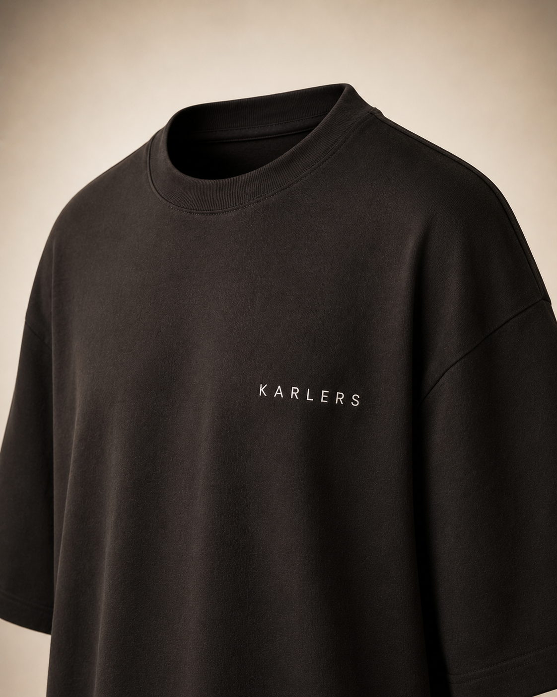 KARLERS Essential Tee in ink, three-quarter view showing the boxy oversized fit